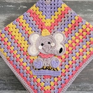 Handcrafted crochet granny square baby blanket with vintage circus elephant.